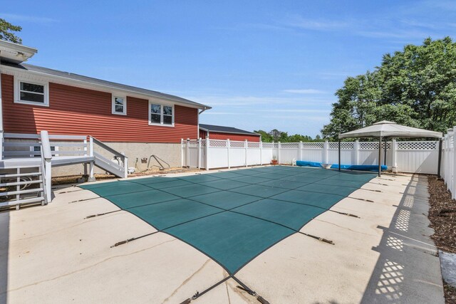 view of pool with a patio, a fenced in pool, and a fenced backyard