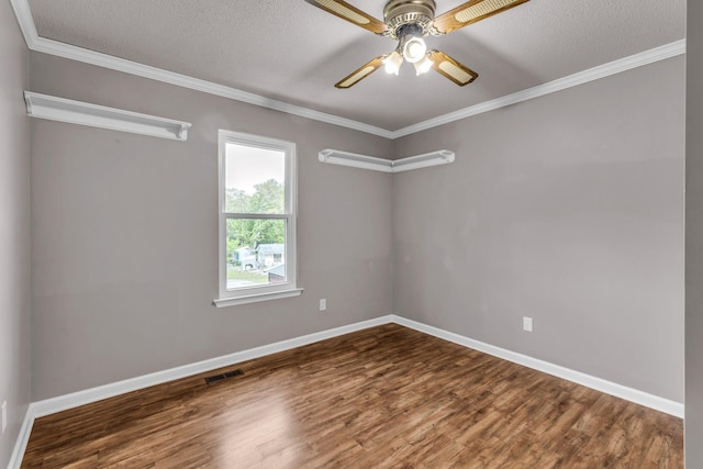 unfurnished room featuring wood finished floors, baseboards, visible vents, a ceiling fan, and crown molding