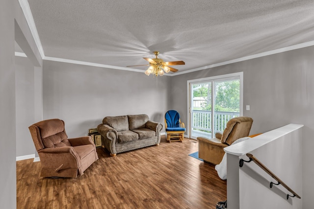 living room with crown molding, a textured ceiling, ceiling fan, and wood finished floors