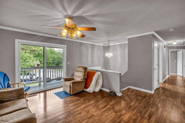 sitting room featuring a textured ceiling, crown molding, visible vents, ceiling fan, and wood finished floors