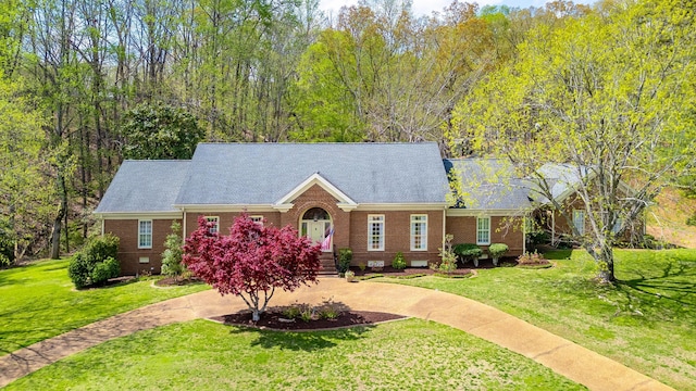 ranch-style home featuring brick siding, a front yard, and crawl space