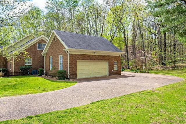 view of property exterior featuring driveway, brick siding, a garage, a yard, and a shingled roof