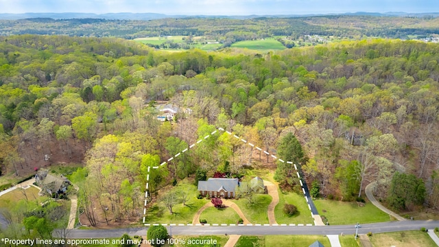 aerial view with a wooded view