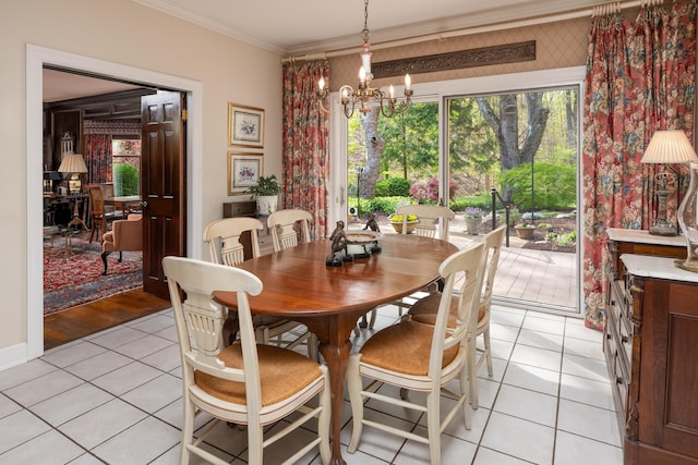 dining area featuring a wealth of natural light, light tile patterned floors, an inviting chandelier, and crown molding