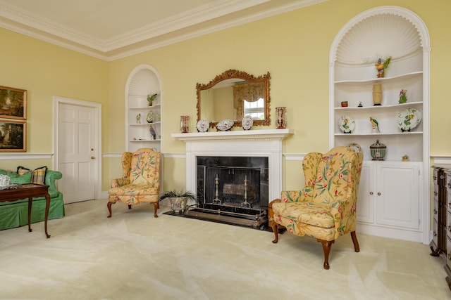 living area featuring crown molding, carpet floors, built in features, and a high end fireplace