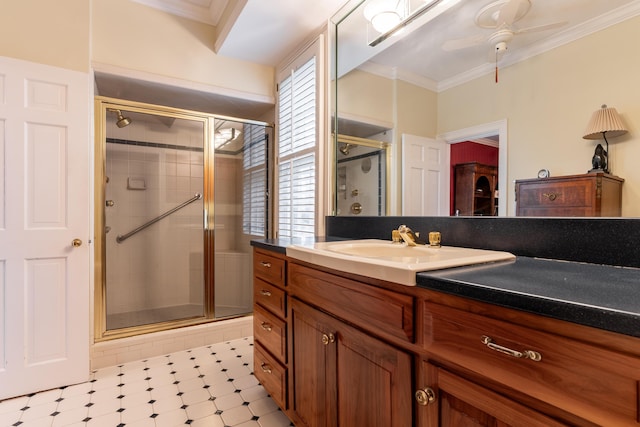 bathroom with a stall shower, a healthy amount of sunlight, ceiling fan, and tile patterned floors