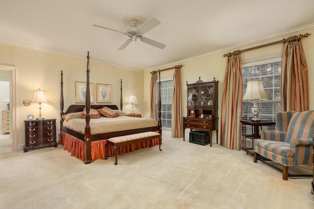 bedroom with ornamental molding, ceiling fan, and light carpet