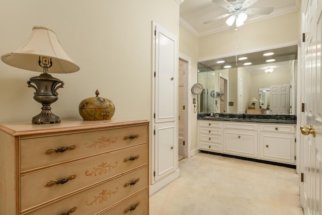 full bath featuring vanity, ornamental molding, and ceiling fan