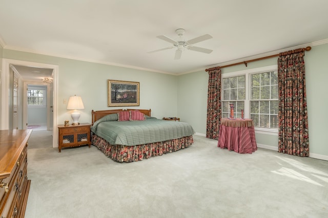 bedroom with carpet flooring, baseboards, and crown molding