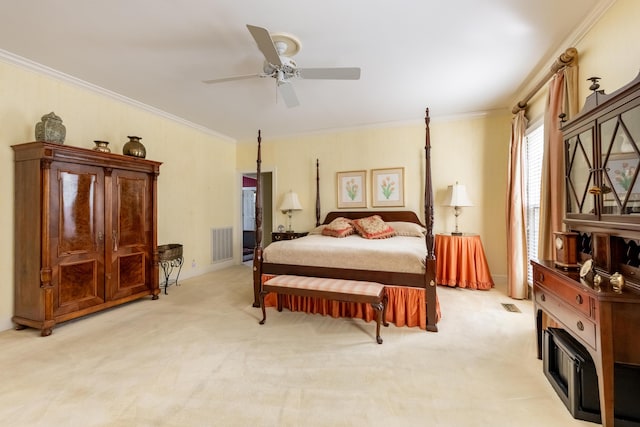 bedroom featuring light carpet, visible vents, ornamental molding, and a ceiling fan