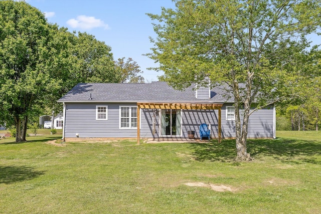 rear view of house with a pergola, roof with shingles, a yard, and a patio area