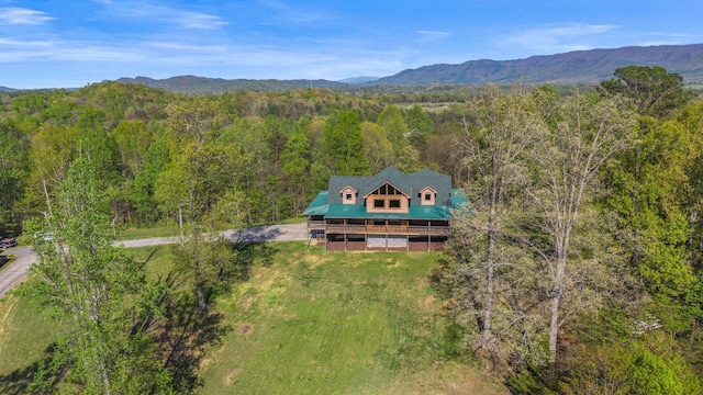 aerial view with a mountain view and a forest view