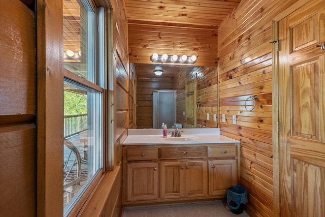 bathroom featuring tile patterned flooring, wooden walls, vanity, and wood ceiling