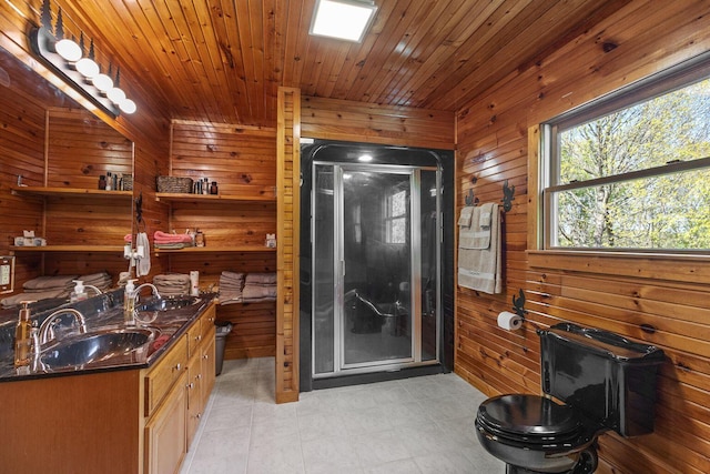 bathroom featuring wooden walls, toilet, and a stall shower