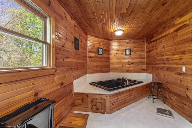bathroom with wood walls, wooden ceiling, and tile patterned flooring