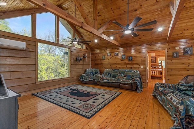 living room with ceiling fan, beamed ceiling, wooden ceiling, wood walls, and a wall mounted air conditioner