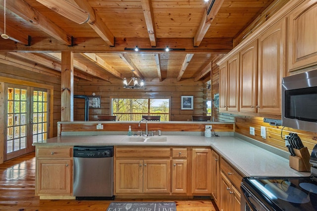 kitchen featuring a sink, wood ceiling, beamed ceiling, stainless steel appliances, and light wood-style flooring