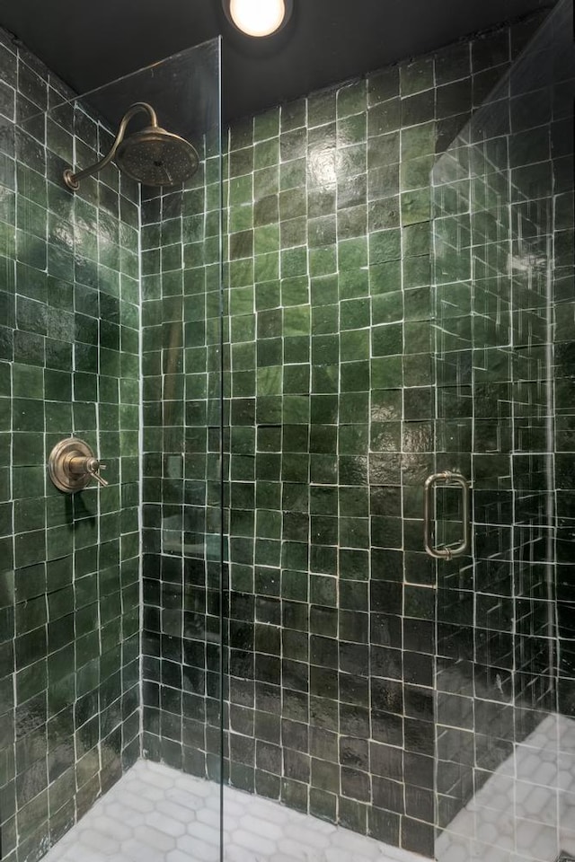 bathroom with a shower stall