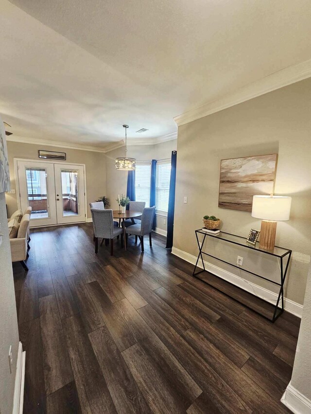 7845 Legacy Park Ct, Chattanooga, TN 37421 - dining space featuring dark wood-style floors, crown molding, french doors, and a chandelier