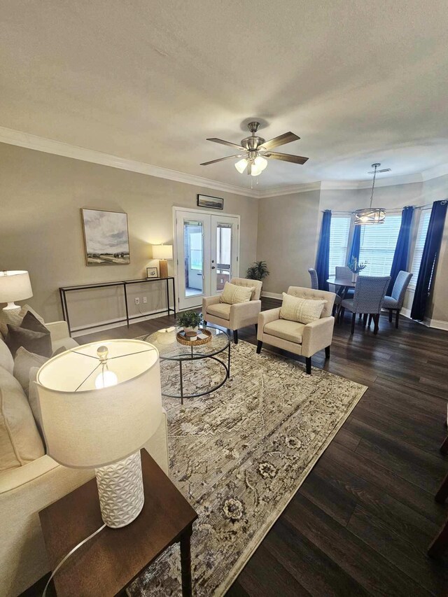 7845 Legacy Park Ct, Chattanooga, TN 37421 - living area featuring healthy amount of natural light, a ceiling fan, dark wood-style floors, crown molding, and a chandelier
