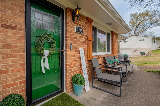 3745 Premium Dr, Chattanooga, TN 37415 - property entrance featuring covered porch and brick siding