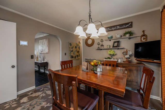3745 Premium Dr, Chattanooga, TN 37415 - dining room with arched walkways, a notable chandelier, crown molding, and baseboards