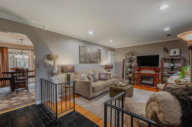3745 Premium Dr, Chattanooga, TN 37415 - living room featuring baseboards, a glass covered fireplace, recessed lighting, and crown molding