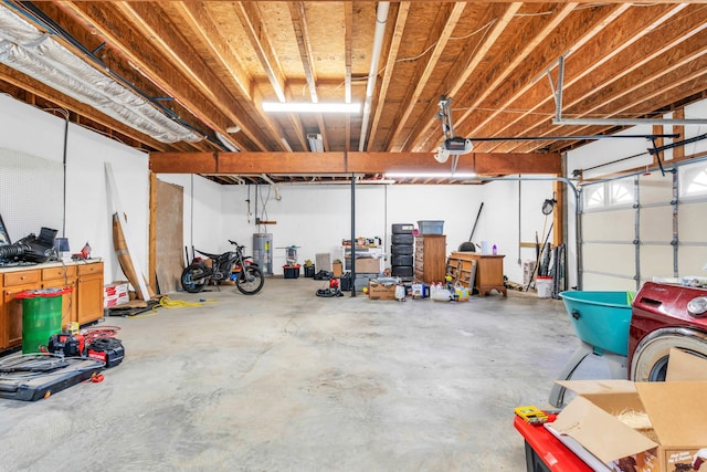garage with a garage door opener and water heater