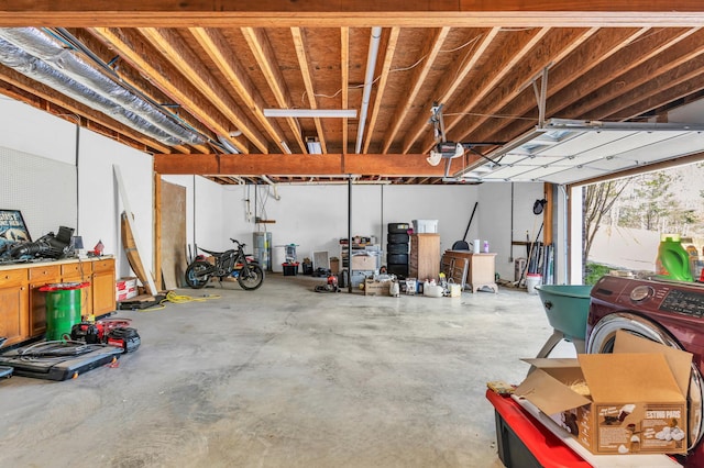 garage with water heater and a garage door opener