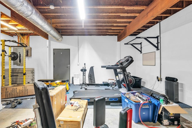 workout area with concrete block wall