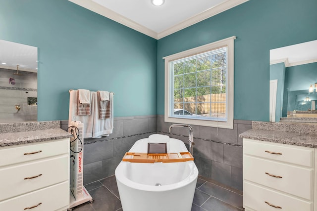 full bathroom featuring tile patterned flooring, wainscoting, and tile walls