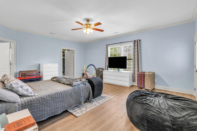 bedroom with light wood-style flooring, ceiling fan, baseboards, and ornamental molding