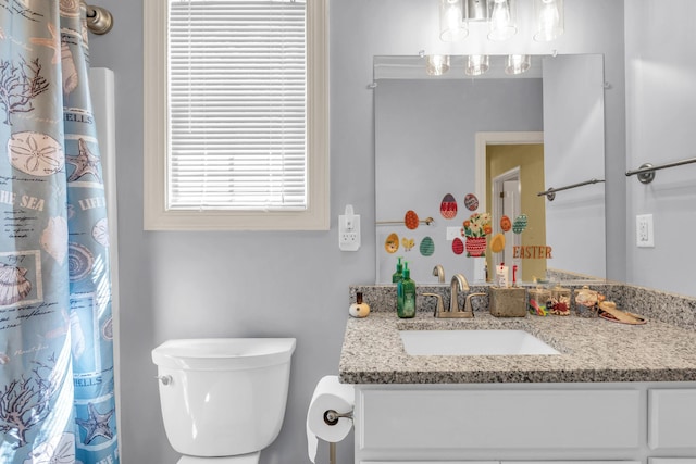 full bath featuring toilet and vanity