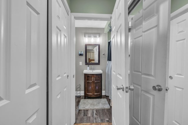 117 Douglas Dr, Chattanooga, TN 37412 - bathroom featuring baseboards, wood finished floors, and vanity