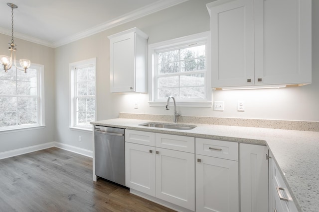 kitchen with a notable chandelier, white cabinetry, crown molding, stainless steel dishwasher, and a sink