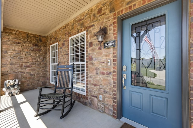 12237 Wildlife Pl, Soddy Daisy, TN 37379 - doorway to property with a porch, brick siding, and stone siding