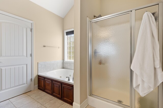 12237 Wildlife Pl, Soddy Daisy, TN 37379 - bathroom featuring a shower stall, vaulted ceiling, tile patterned floors, and a jetted tub