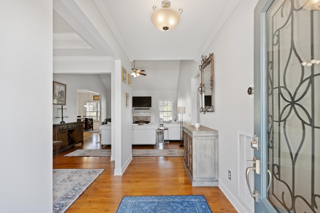 12237 Wildlife Pl, Soddy Daisy, TN 37379 - foyer featuring ceiling fan, light wood finished floors, a fireplace, baseboards, and ornamental molding