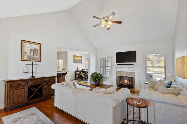 12237 Wildlife Pl, Soddy Daisy, TN 37379 - living room with a tiled fireplace, high vaulted ceiling, ceiling fan, and dark wood-style floors