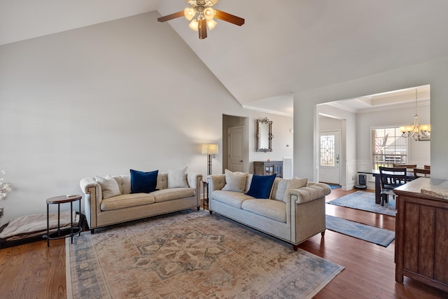 12237 Wildlife Pl, Soddy Daisy, TN 37379 - living area featuring ceiling fan with notable chandelier, wood finished floors, and high vaulted ceiling