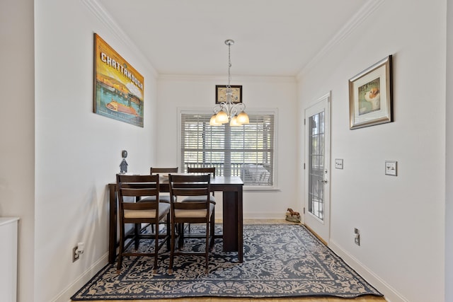 12237 Wildlife Pl, Soddy Daisy, TN 37379 - dining room with baseboards, crown molding, and a chandelier