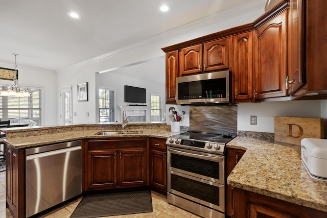 12237 Wildlife Pl, Soddy Daisy, TN 37379 - kitchen featuring stainless steel appliances, ornamental molding, a sink, light stone countertops, and a peninsula