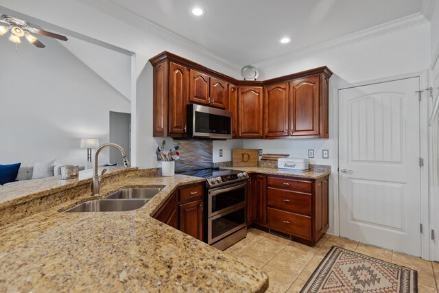 12237 Wildlife Pl, Soddy Daisy, TN 37379 - kitchen with stainless steel appliances, a sink, a ceiling fan, light stone countertops, and light tile patterned floors