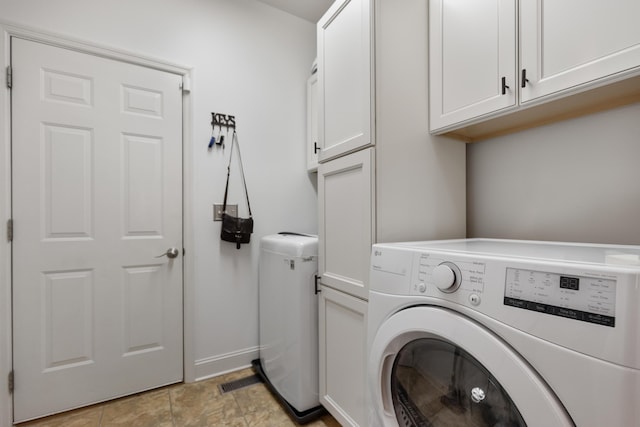 12237 Wildlife Pl, Soddy Daisy, TN 37379 - laundry room featuring washer / clothes dryer and cabinet space