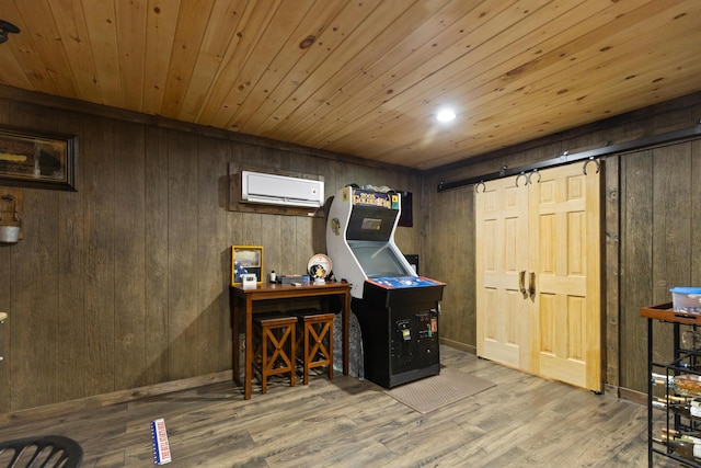12237 Wildlife Pl, Soddy Daisy, TN 37379 - playroom with a barn door, wooden walls, a wall mounted air conditioner, and wood ceiling