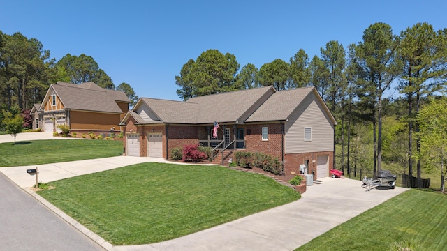 12237 Wildlife Pl, Soddy Daisy, TN 37379 - view of front facade featuring brick siding, driveway, and a front yard