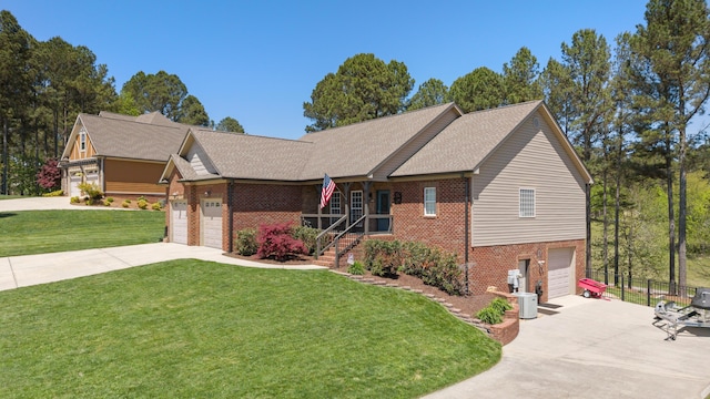 12237 Wildlife Pl, Soddy Daisy, TN 37379 - ranch-style house with fence, concrete driveway, brick siding, a front yard, and a garage