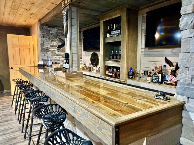 12237 Wildlife Pl, Soddy Daisy, TN 37379 - bar featuring wood finished floors, wooden ceiling, wood walls, and bar