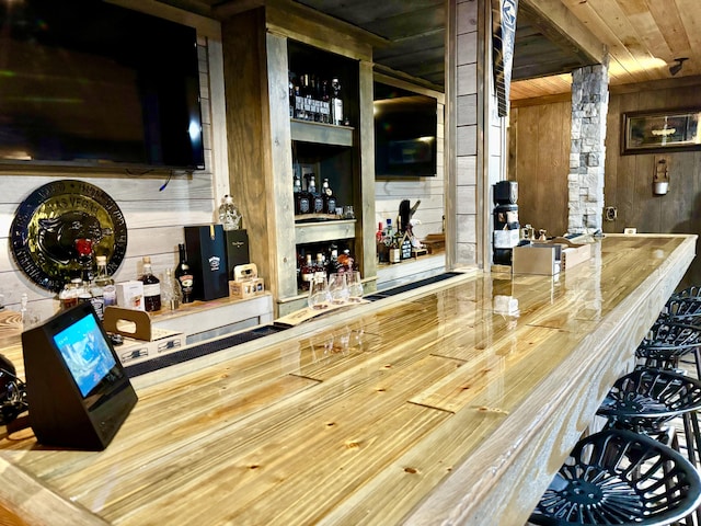 12237 Wildlife Pl, Soddy Daisy, TN 37379 - bar with wooden ceiling, wood walls, a dry bar, and decorative columns