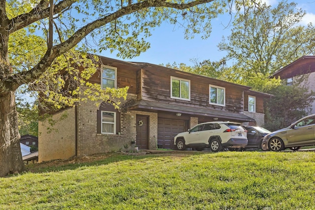 810 Forest Dale Ln, Hixson, TN 37343 - view of front of house with brick siding, an attached garage, and a front lawn